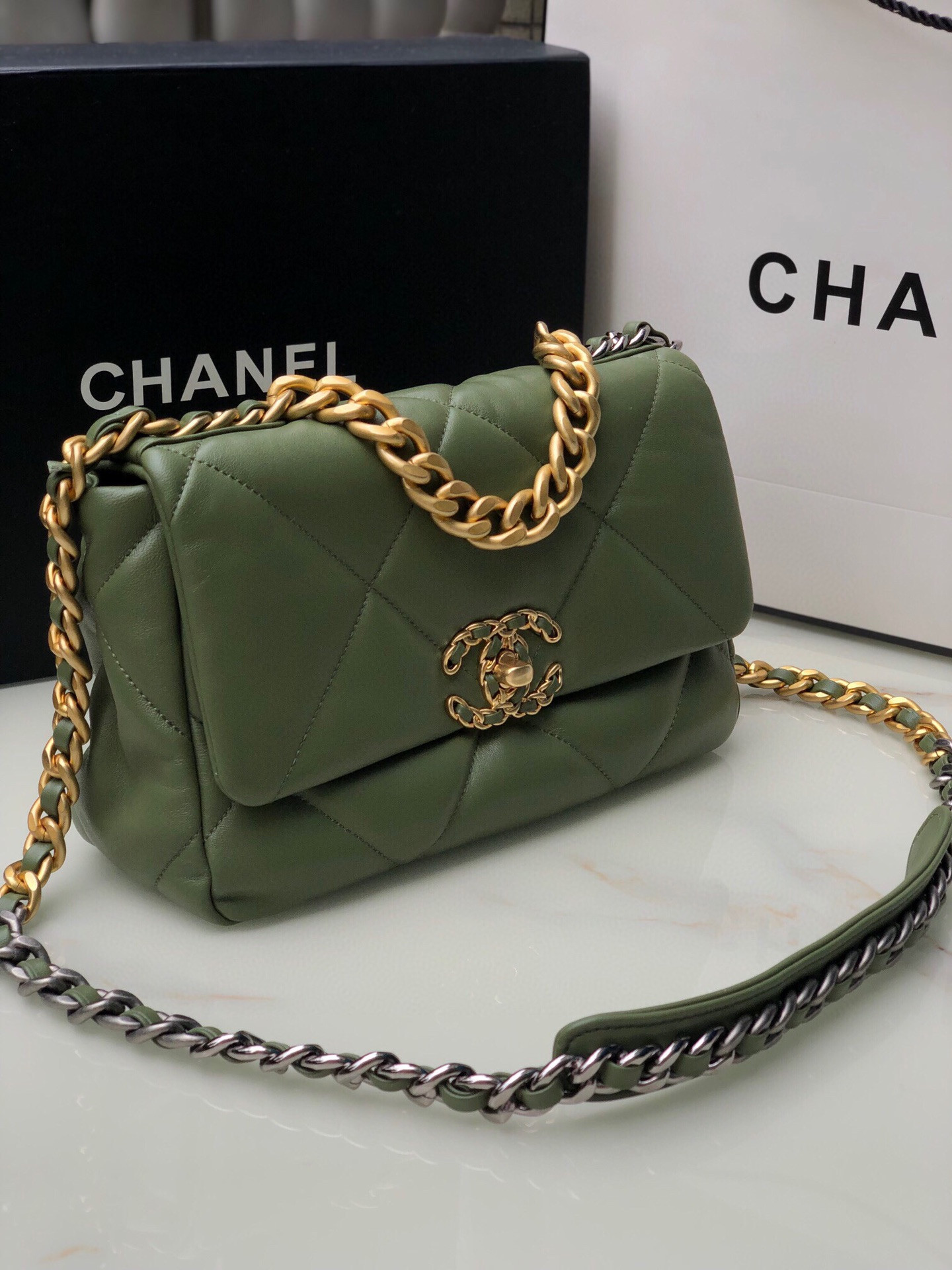 Ch*el 19 handbag shiny leather, gold-tone 16×26×9cm
