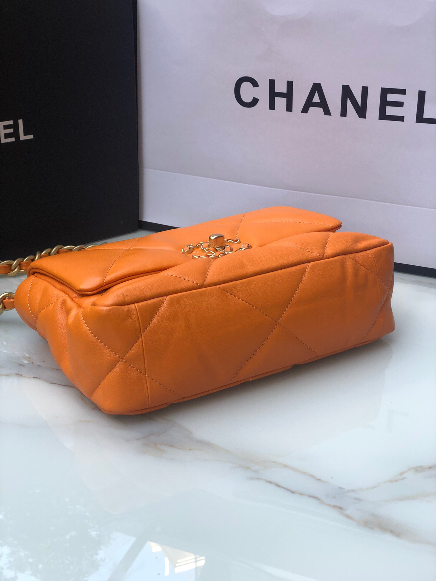 Ch*el 19 handbag shiny leather, gold-tone, silver-tone & ruthenium-finish metal orange 6.2 × 10.1 × 3.5 in