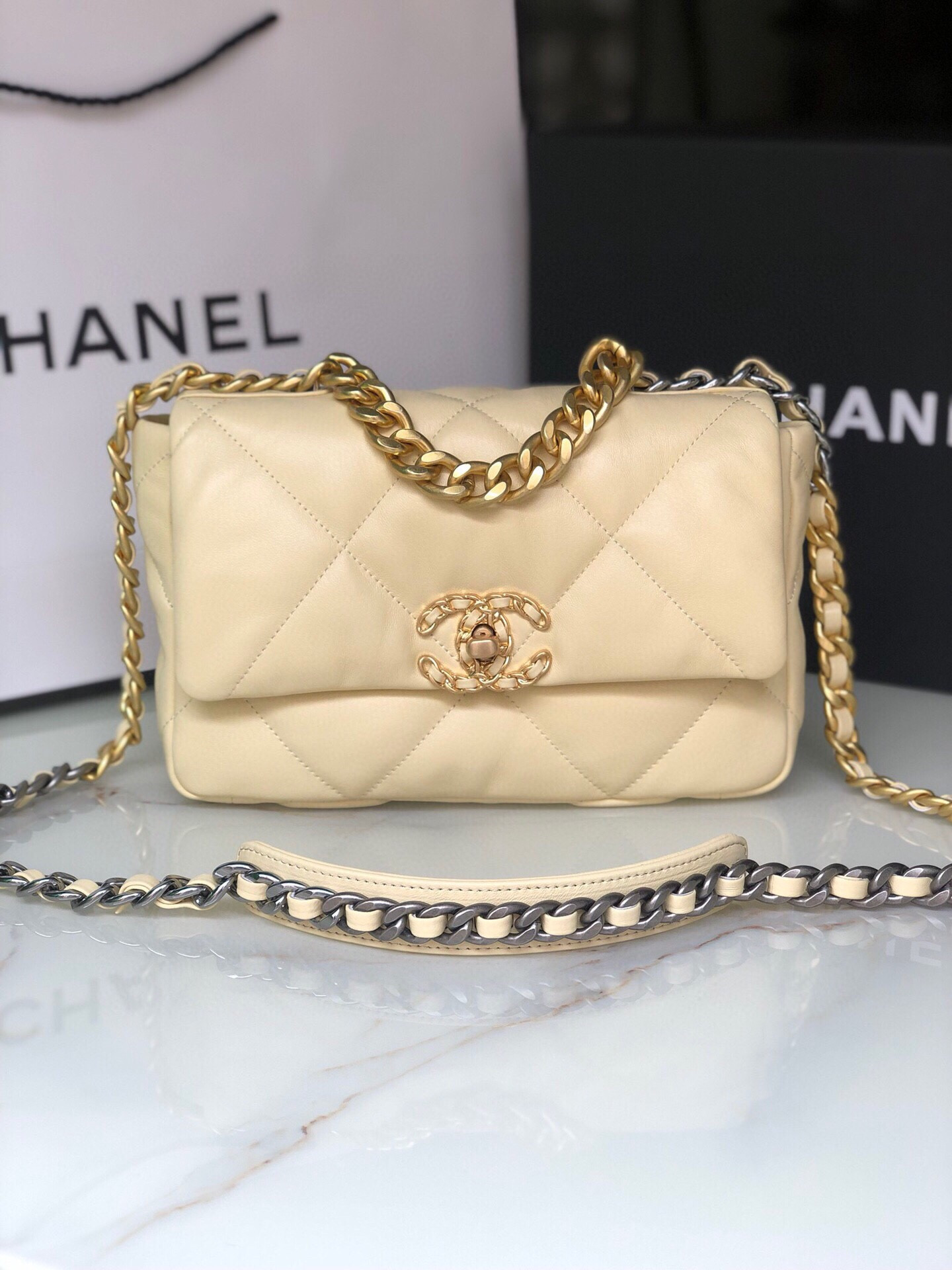 Ch*el 19 handbag shiny leather, gold-tone, silver-tone & ruthenium-finish metal dark yellow 6.2 × 10.1 × 3.5 in