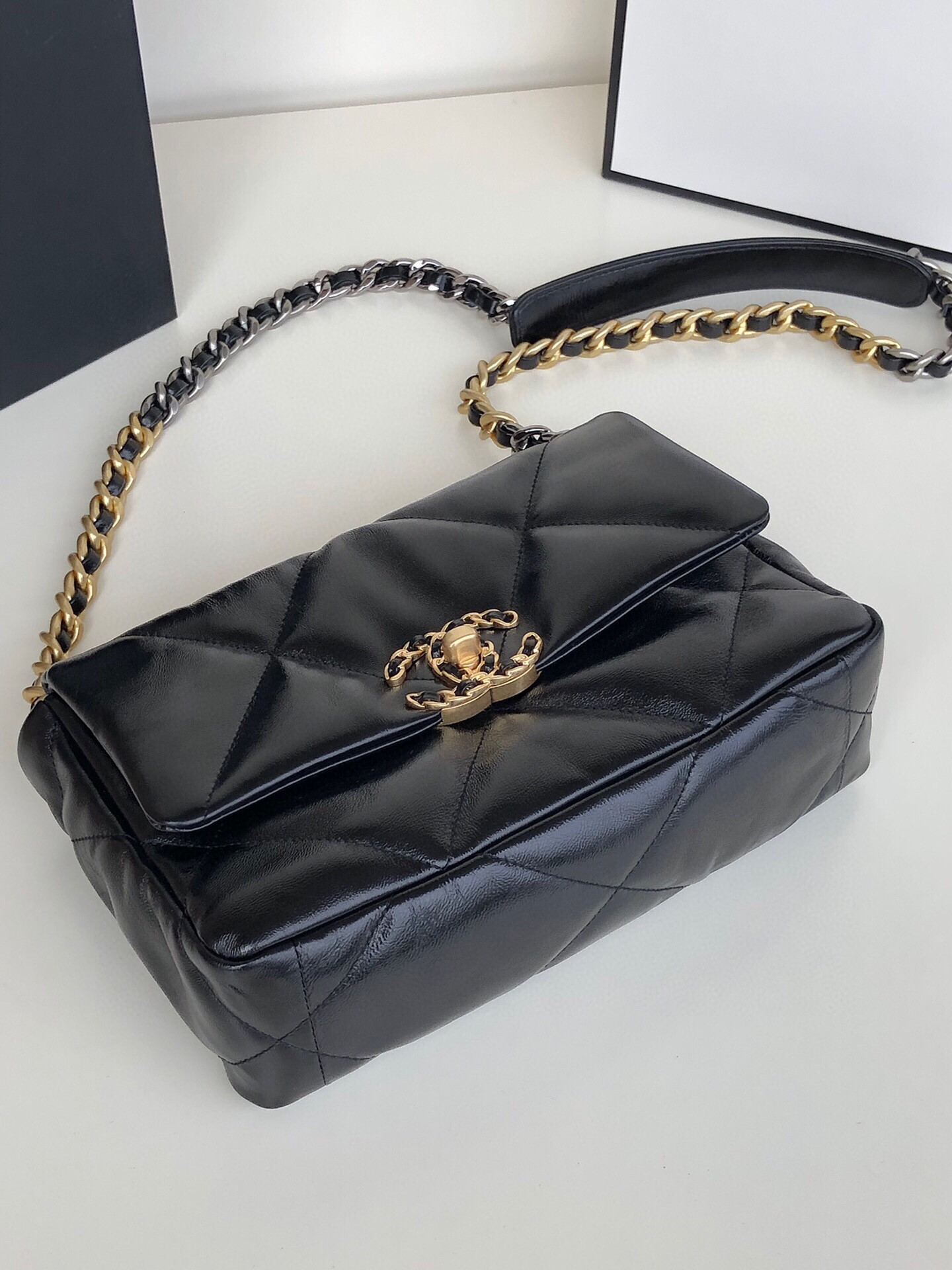 Ch*el 19 handbag shiny leather, gold-tone, silver-tone & ruthenium-finish metal black 6.2 × 10.1 × 3.5 in
