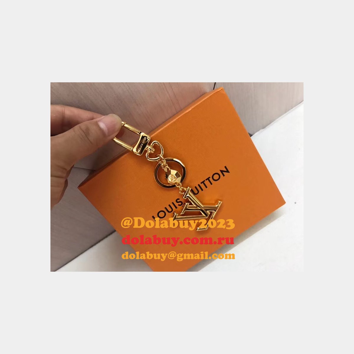 Fake LV Wholesale Facettes Bags Charm & Key Holder M65216 Gold